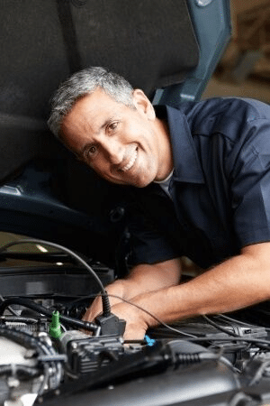 Car mechanic repairing car engine