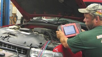 A professional doing an auto repair in Yorkville, IL